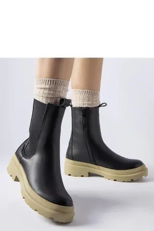 Black ankle boots with an olive sole